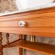 Antique washbasin cabinet in solid pitch pine with a white marble top.
