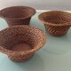 Trio of vintage woven rattan and wicker baskets