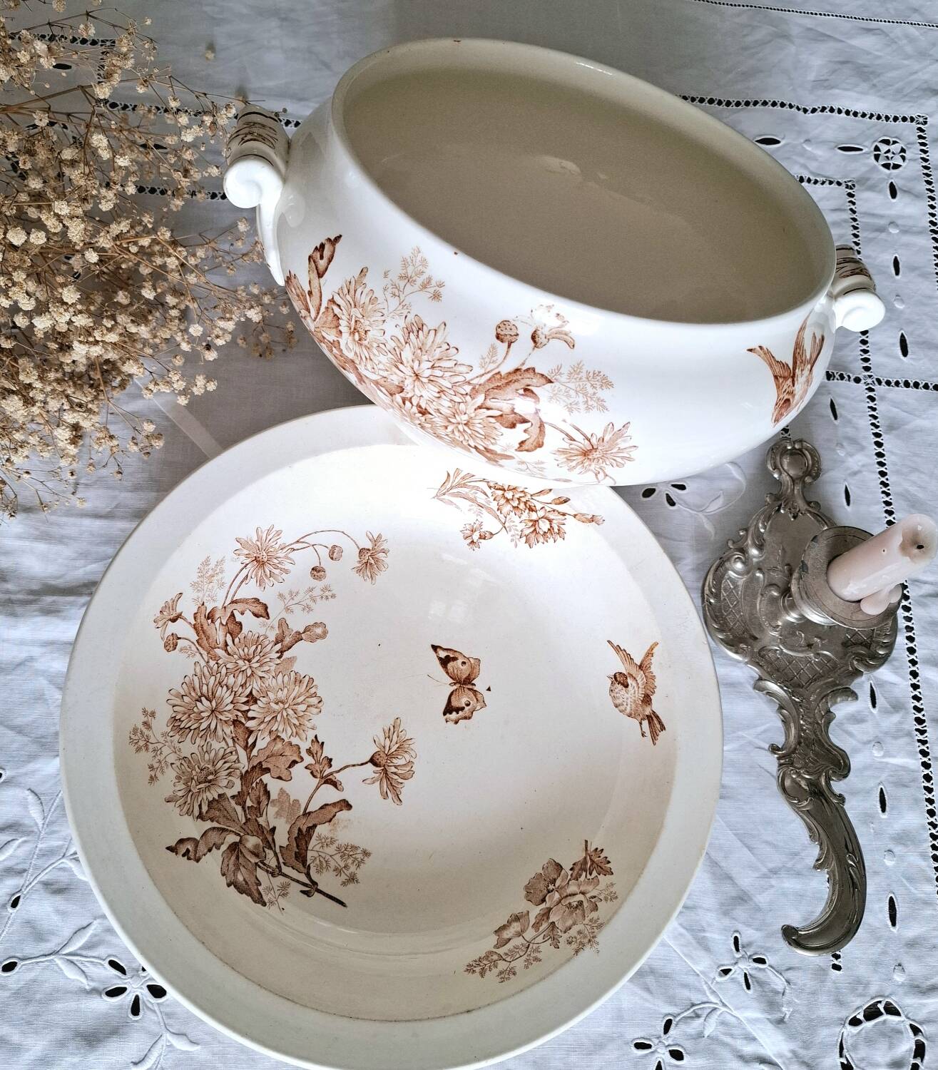 Antique iron earthenware plates accompanied by dishes