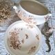 Antique iron earthenware plates accompanied by dishes