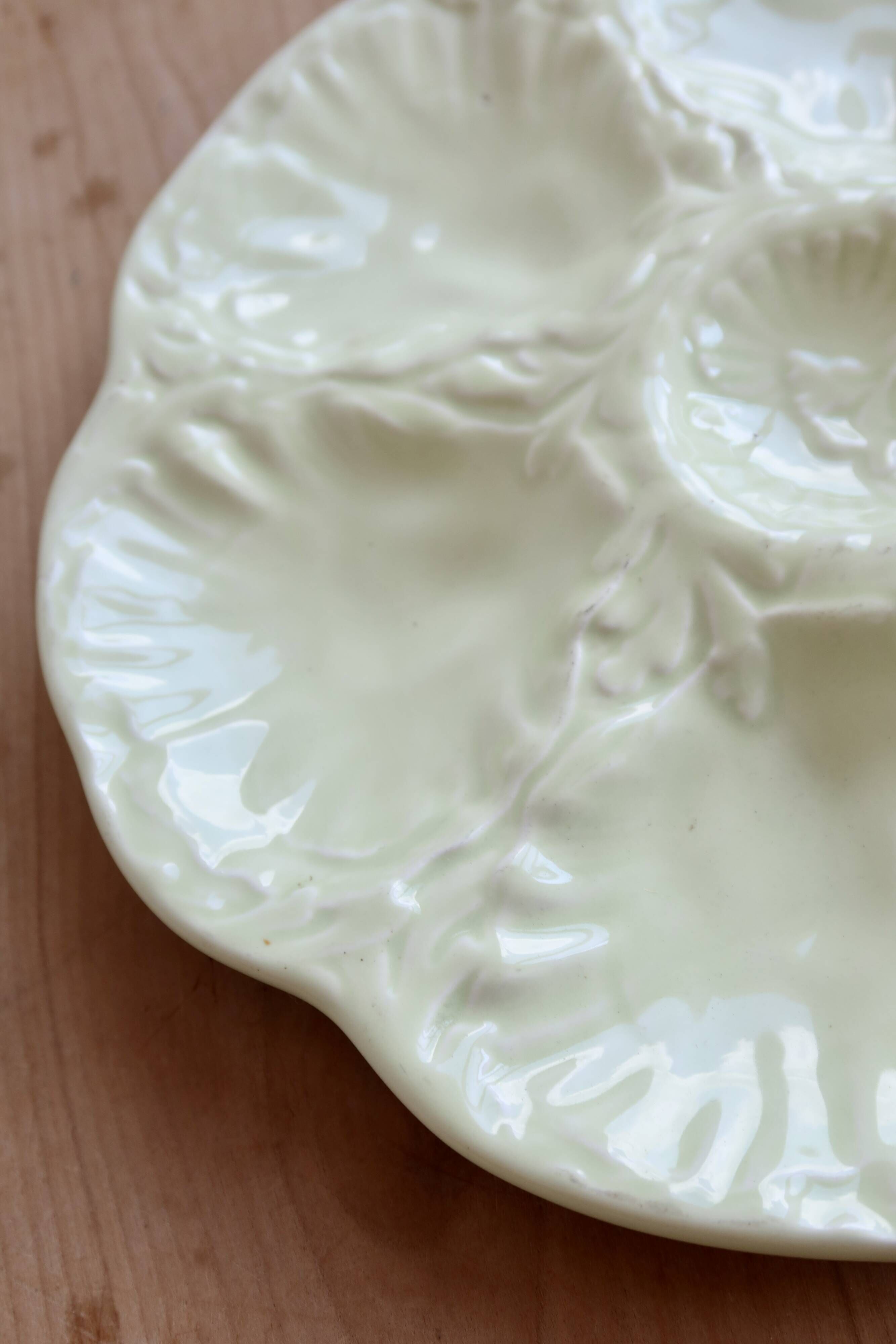Vintage Gien oyster plate in almond green earthenware.