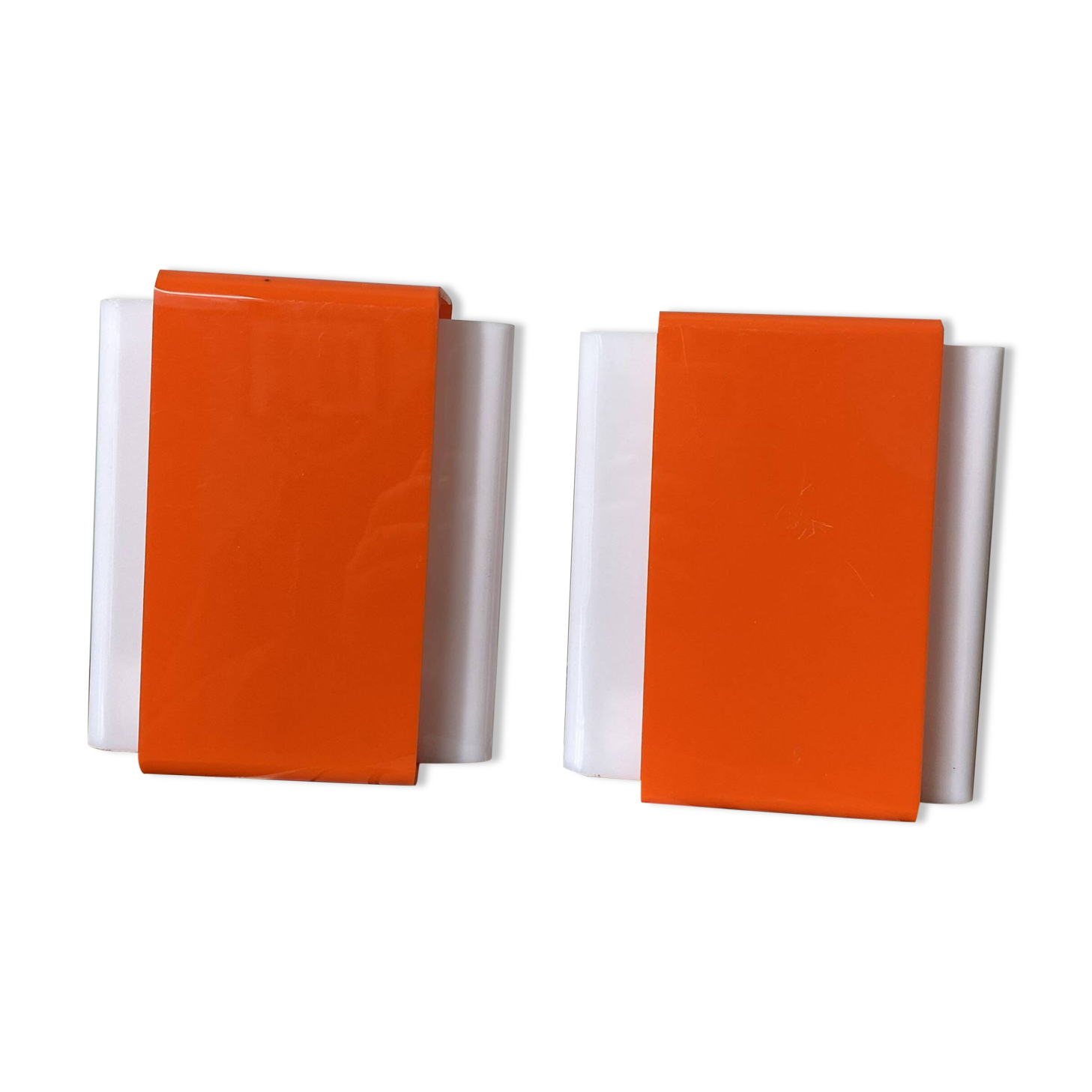 Pair of orange plexiglass wall sconces from the seventies.