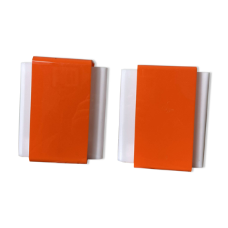 Pair of orange plexiglass wall sconces from the seventies.