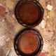 Pair of turned and carved wooden bottle coasters from the 1950s.