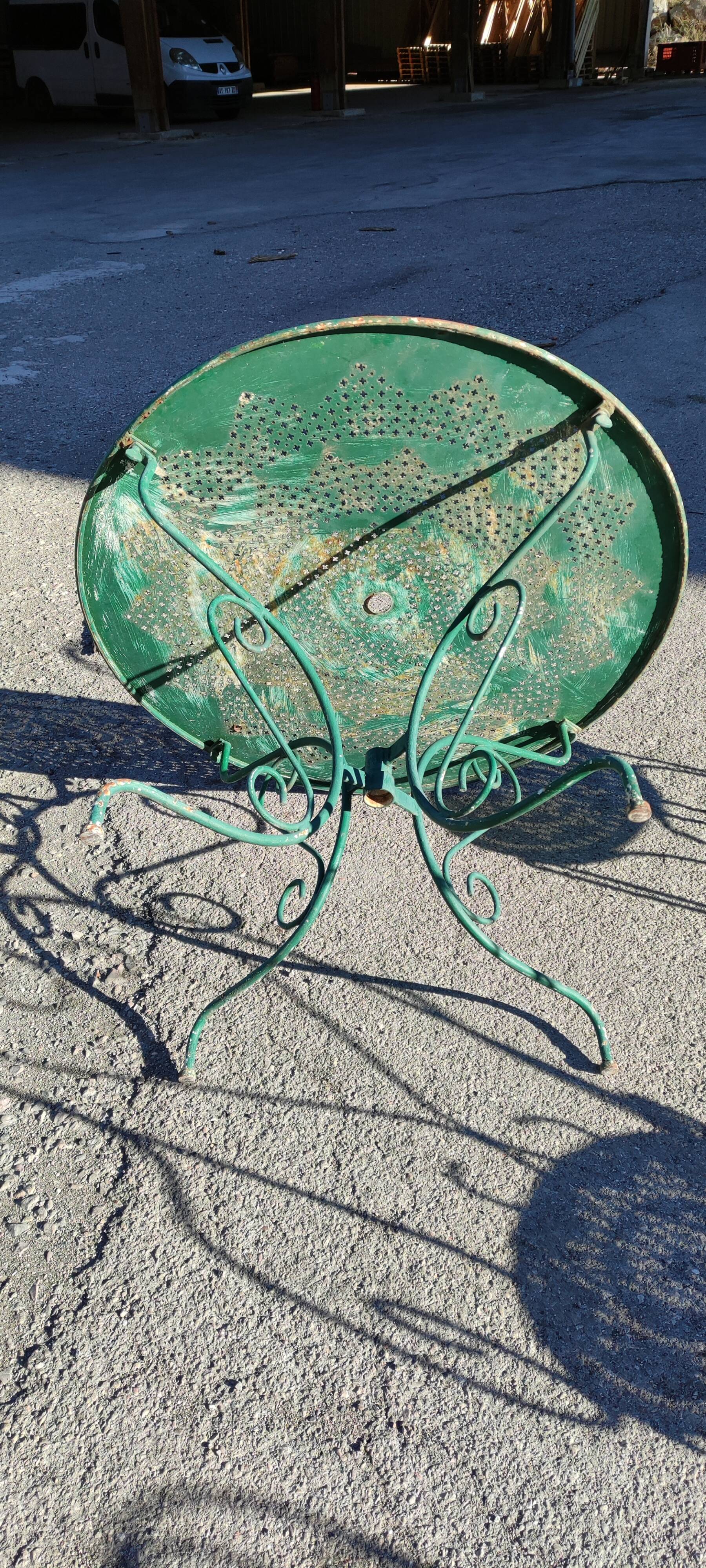 Garden table, two armchairs and a metal chair