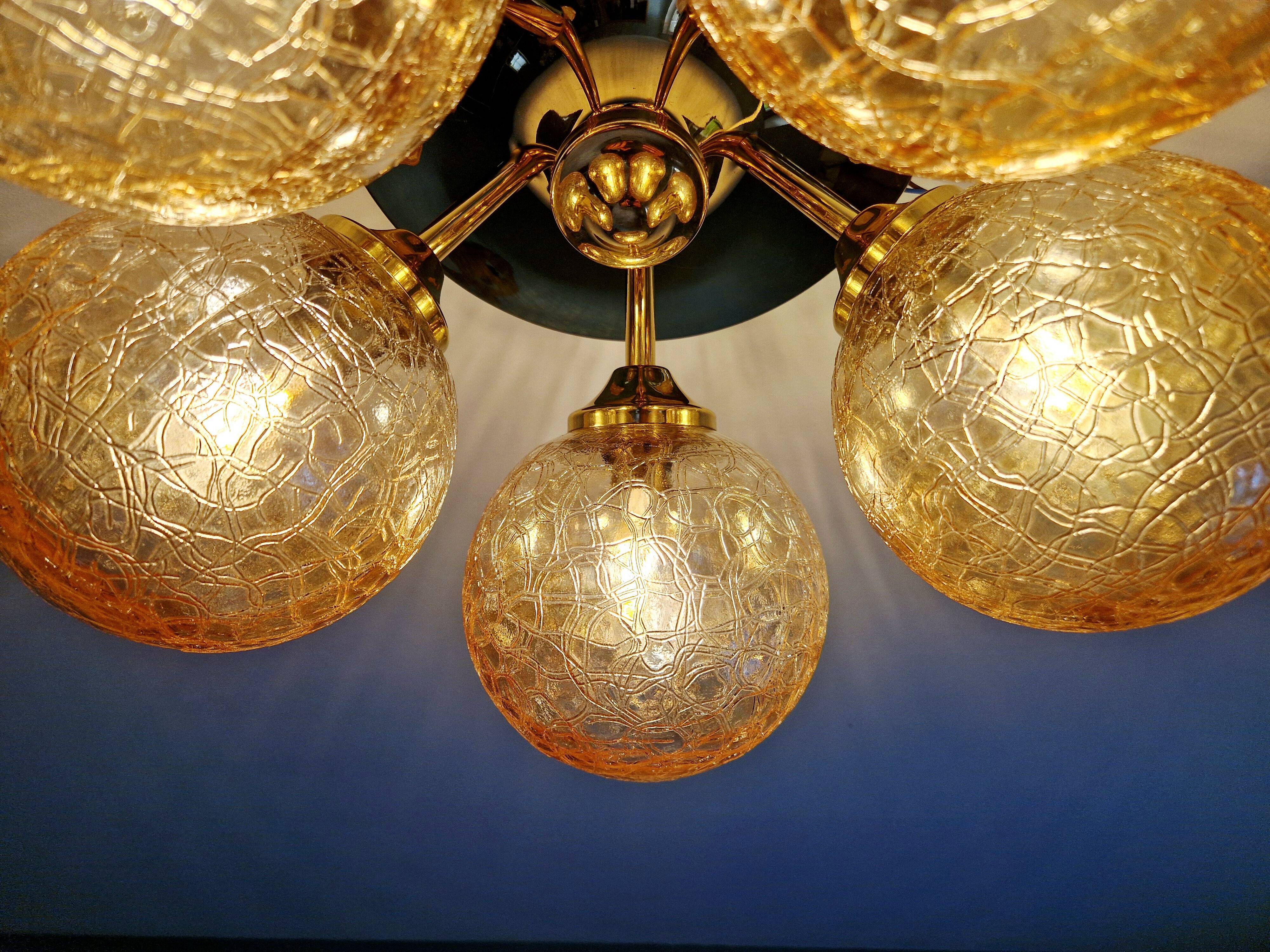Large designer ceiling light in brass and amber crackled glass, 1970s.