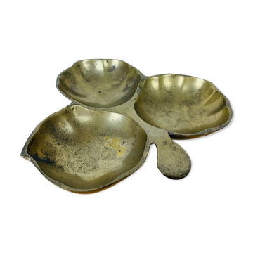 Empty golden brass clover pocket