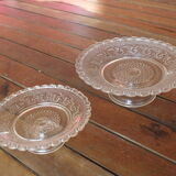 Duo of molded glass display cups, arabesque décor