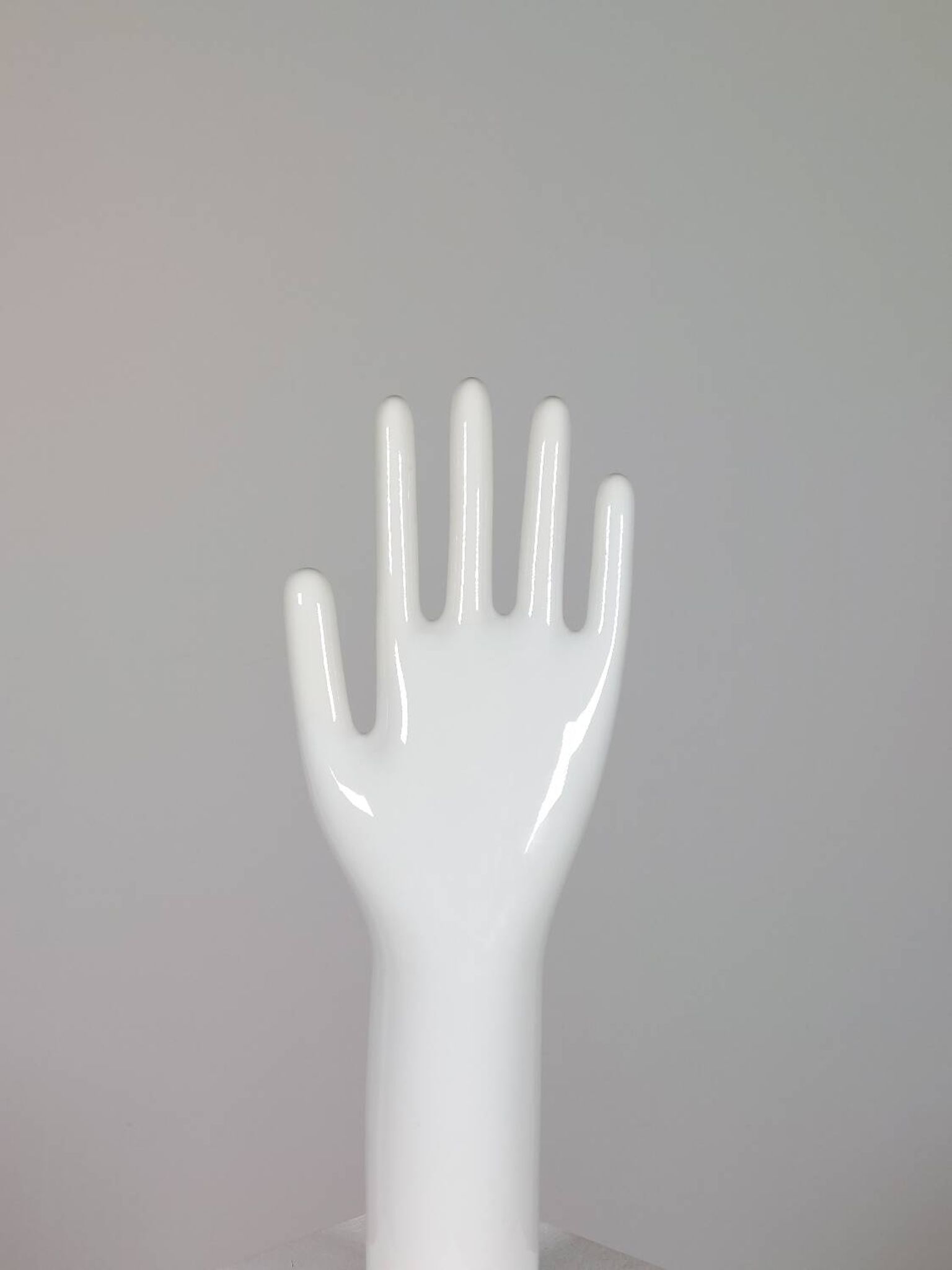 Pair of authentic vintage jewellery displays in industrial porcelain representing hands.