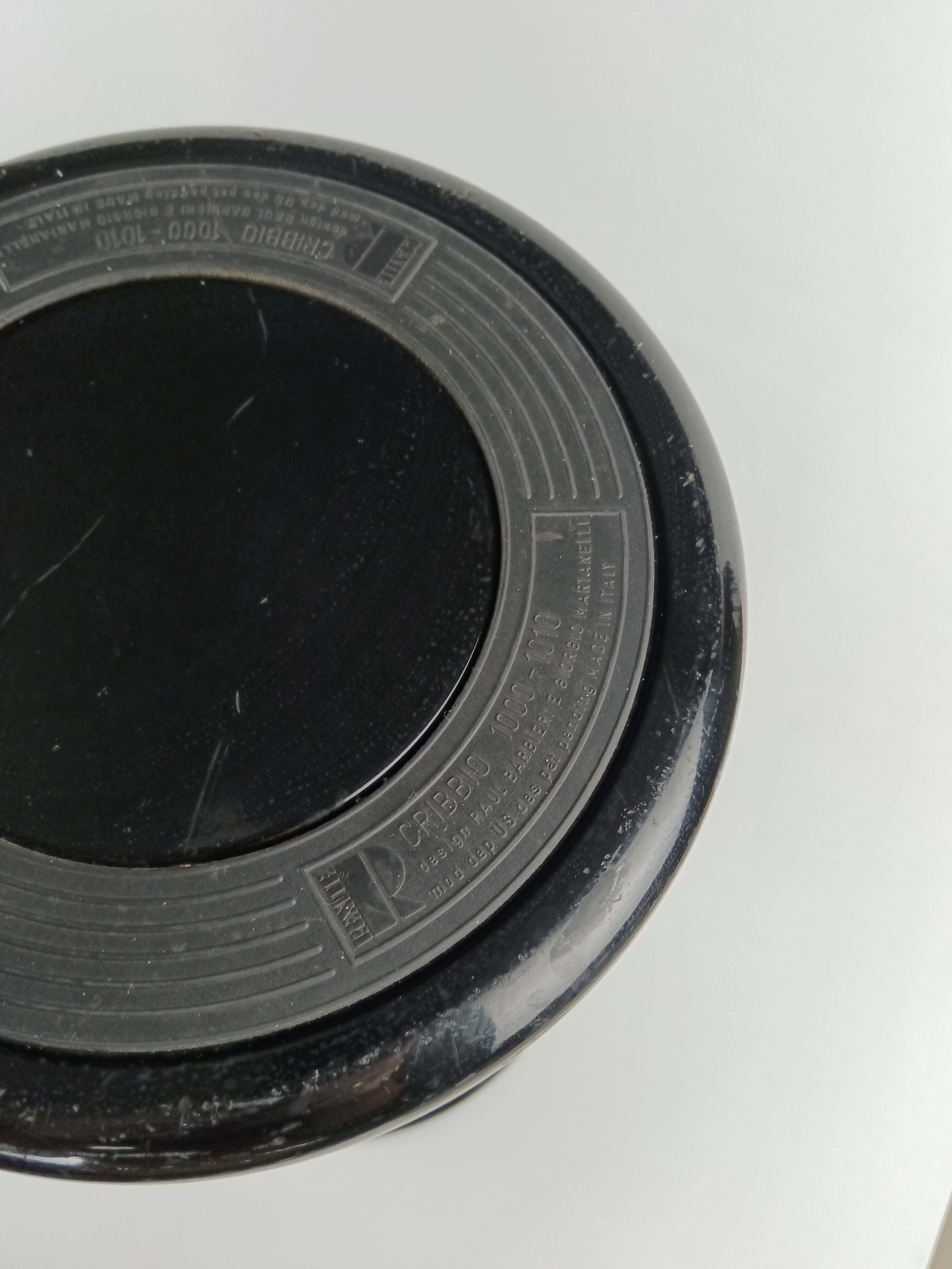 Perforated metal wastebasket