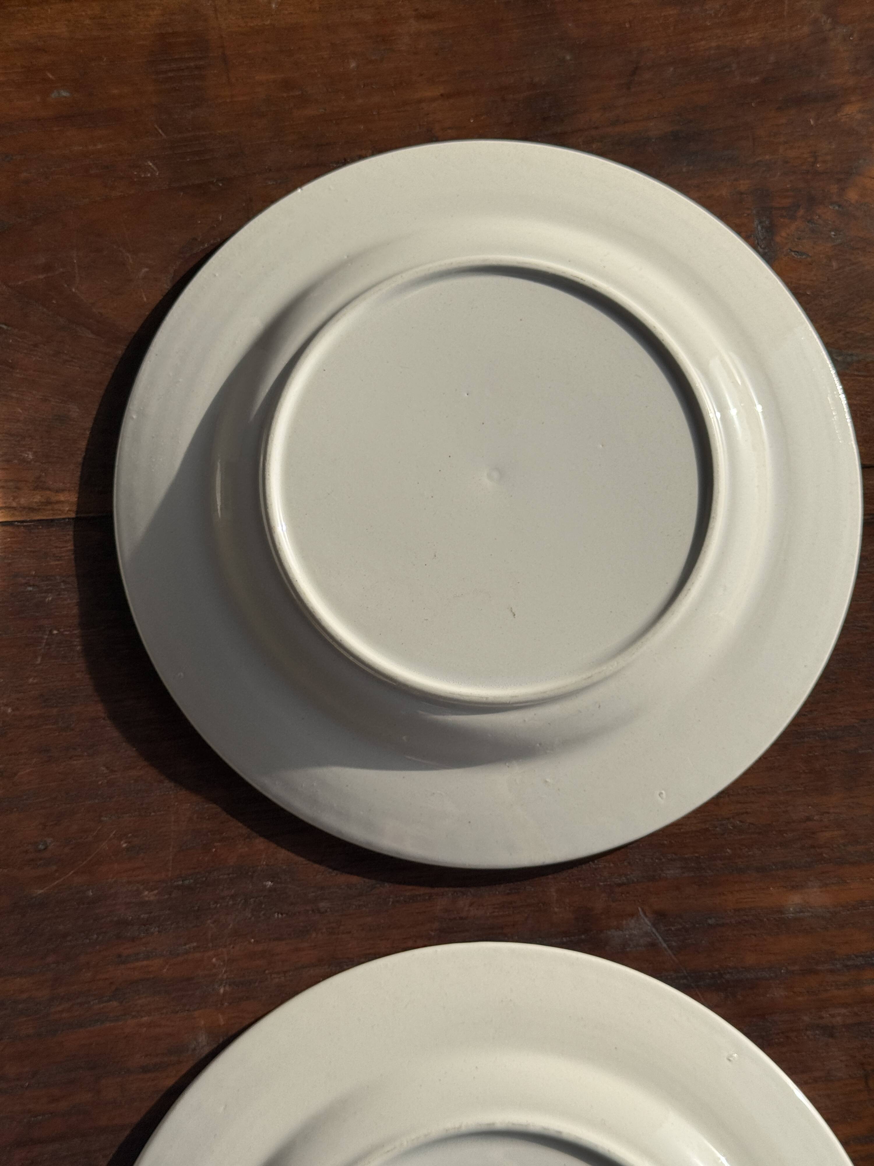 Set of 4 small dessert plates with a vintage stylised flower pattern.