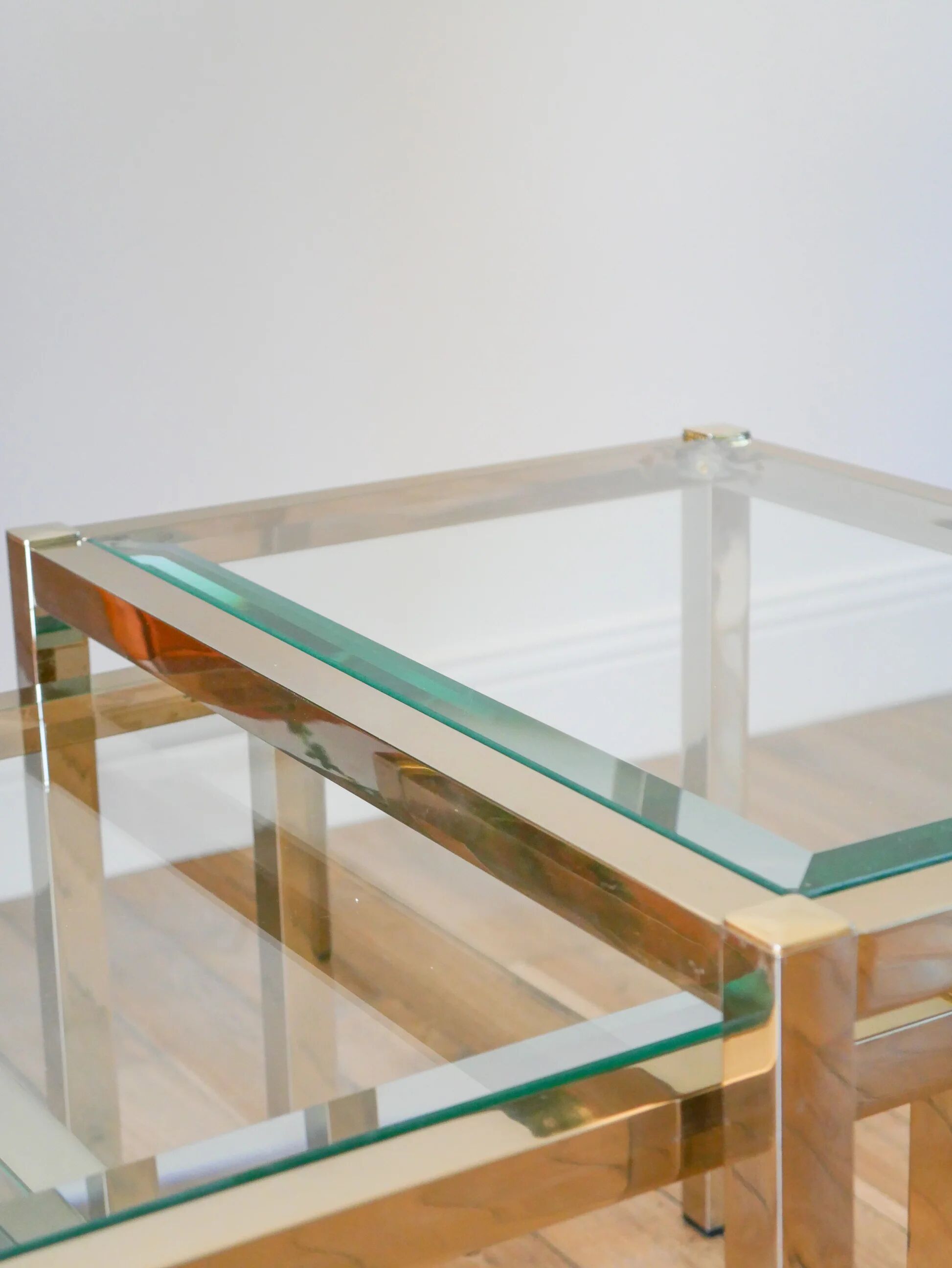 Set of three nesting coffee tables, gilt brass with beveled glass tops, 1980