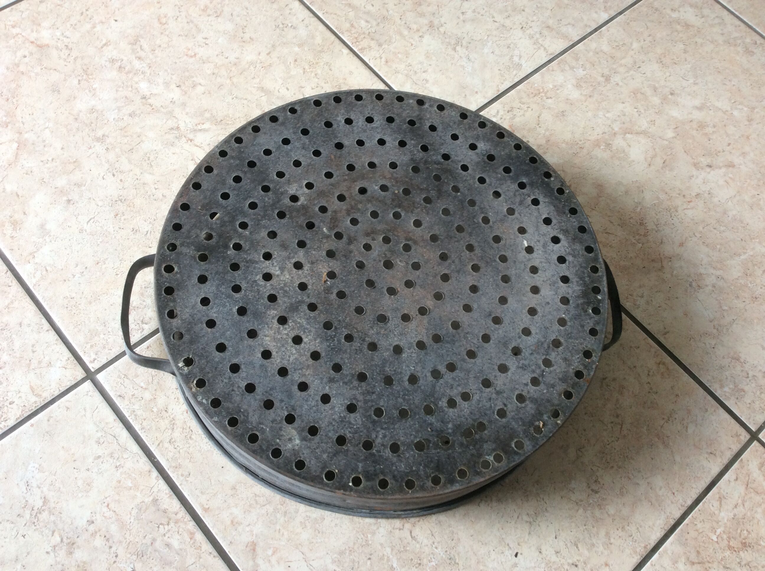 Ancient zinc sieve