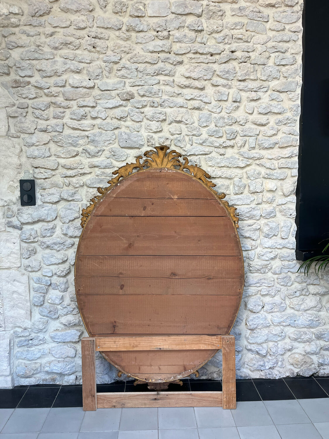 Oval mirror with pediment, beaded gilded with gold leaf