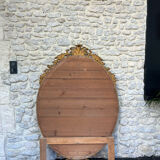 Oval mirror with pediment, beaded gilded with gold leaf