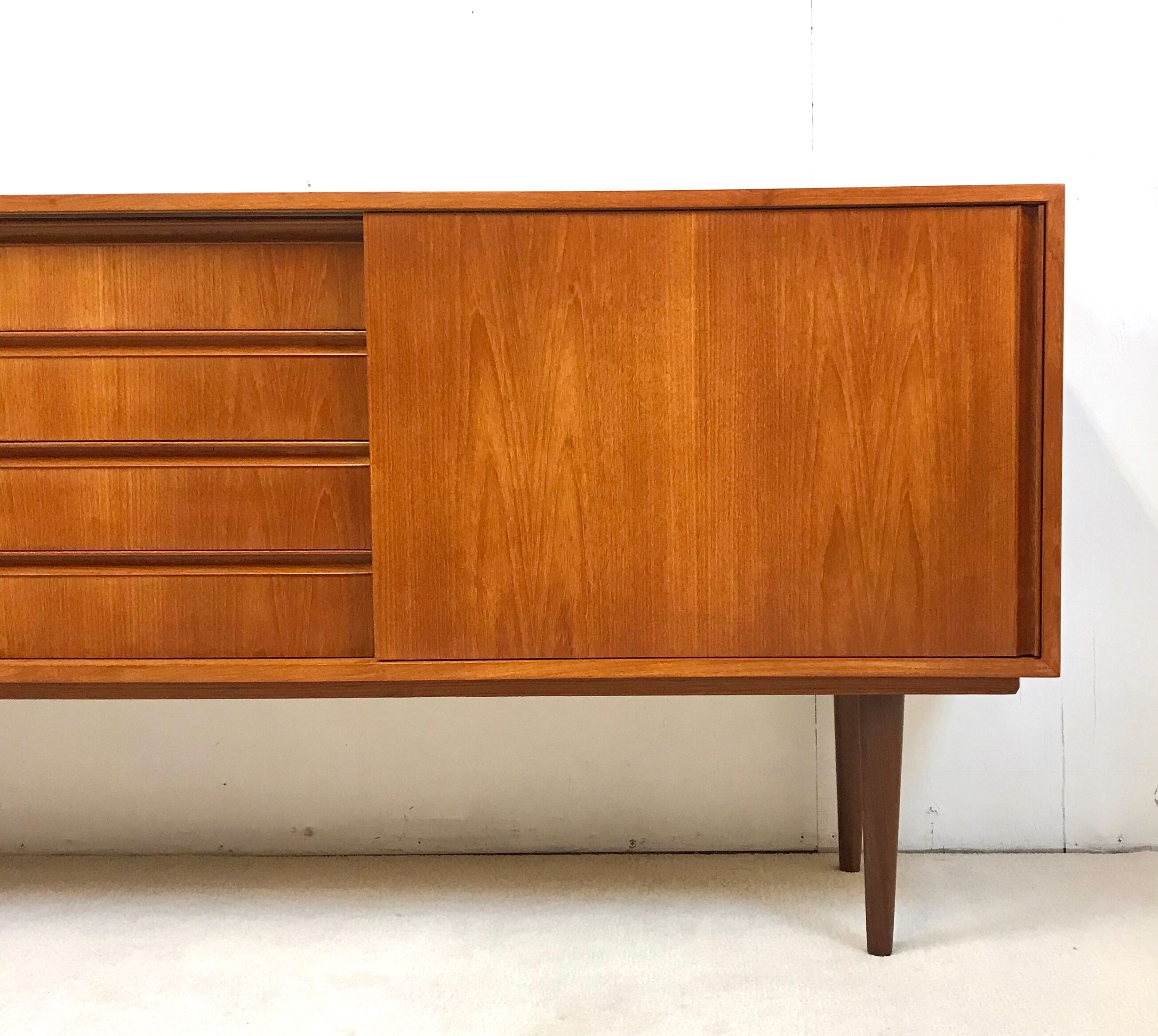 Danish teak sideboard with two sliding doors and 4 central drawers