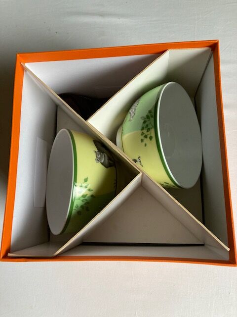 Two Hermès breakfast cups in their packaging