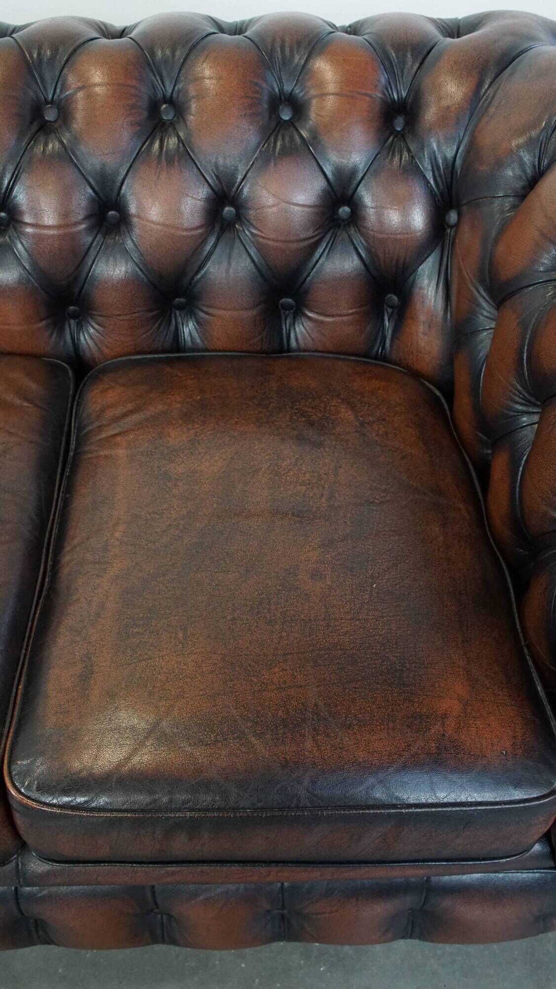 Classic English Chesterfield 2.5 seater sofa in brown cowhide