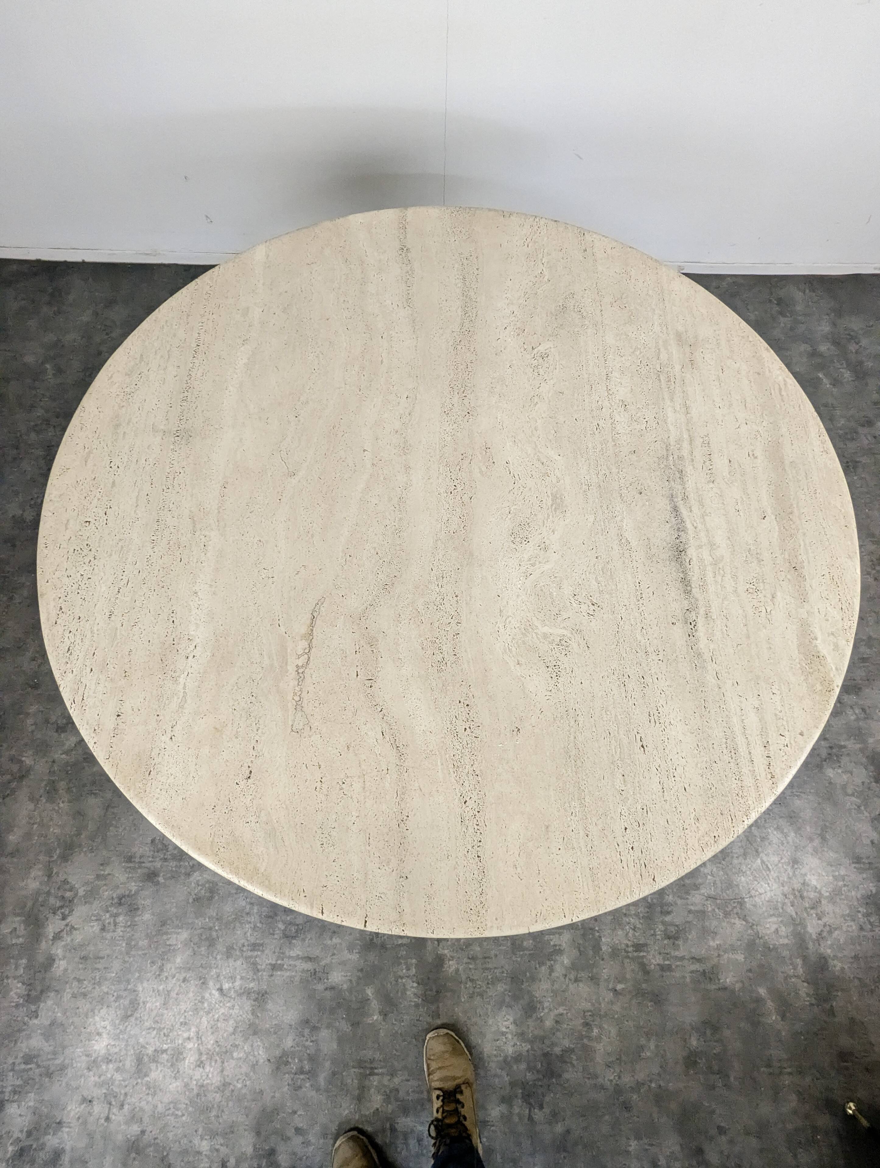 Italian dining table with a travertine top.