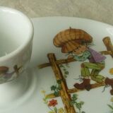 Porcelain egg cup on frame Limoges Poulbot de Paris