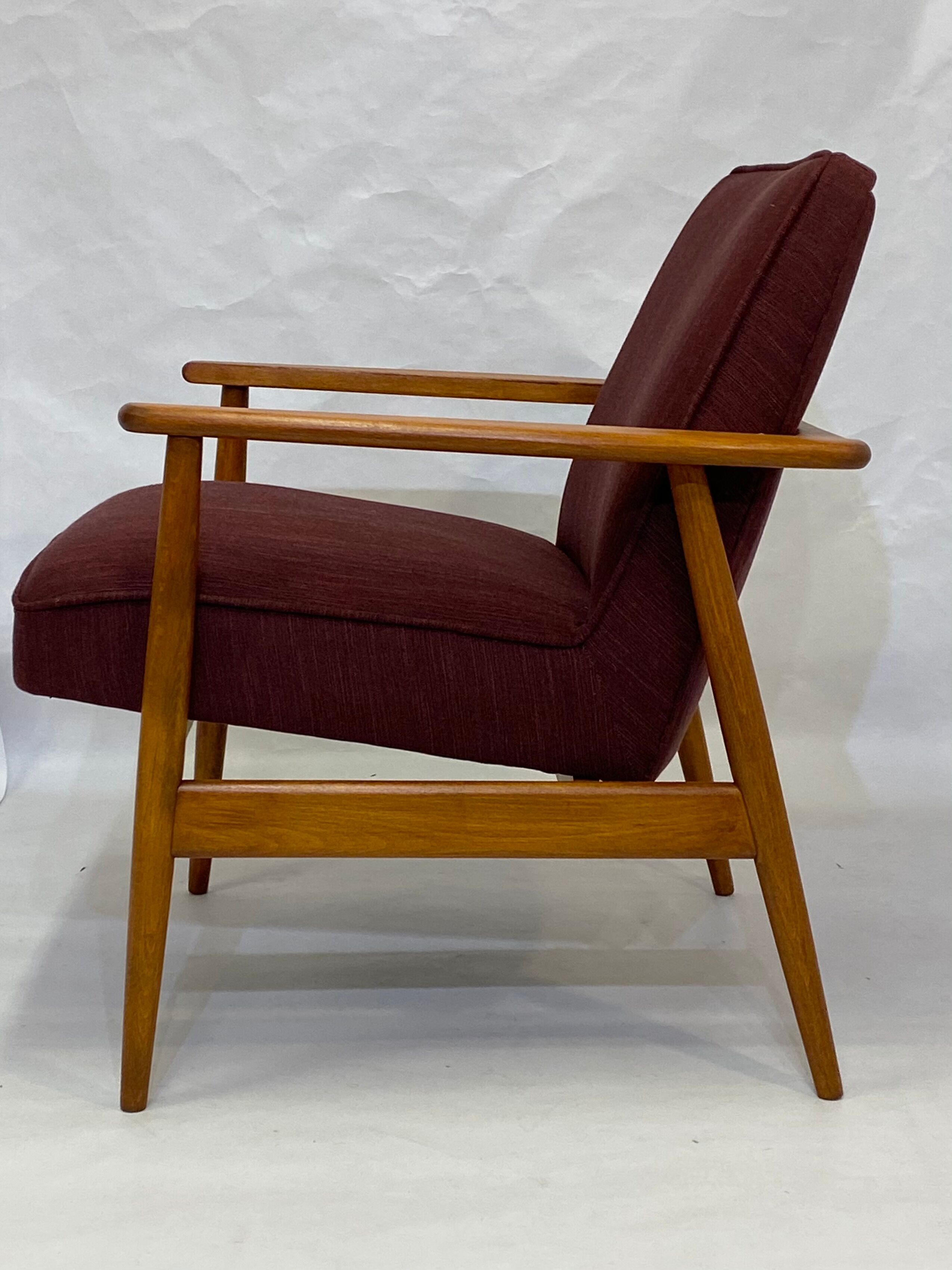 Chair created by Mr. Zieliski year 60 burgundy fabric.
