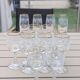 Set of 15 engraved crystal glasses with a gold rim.