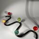 Coat rack in black lacquered metal and colored wooden balls