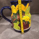 Ceramic pitcher with fruit and vine decoration - colorful rustic style