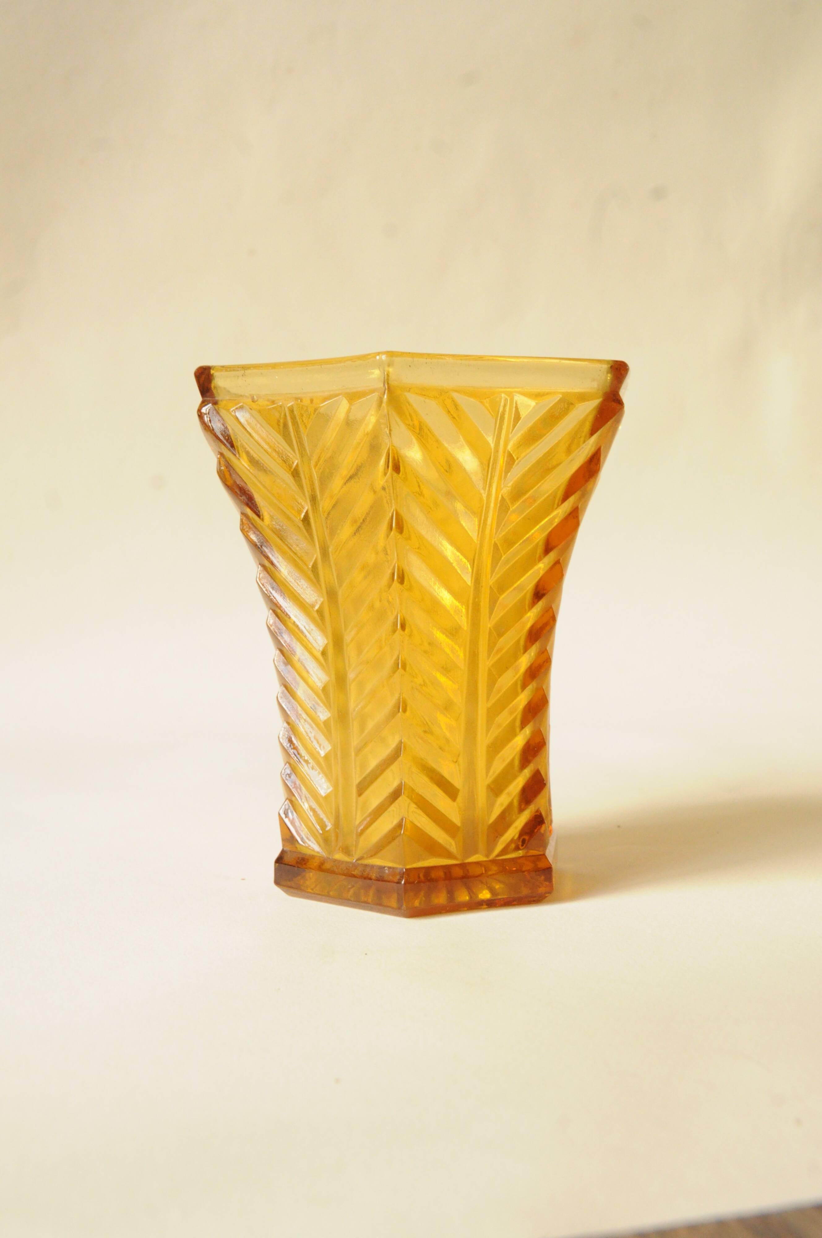 Vintage Art Deco vase in amber yellow cut glass with geometric design.
