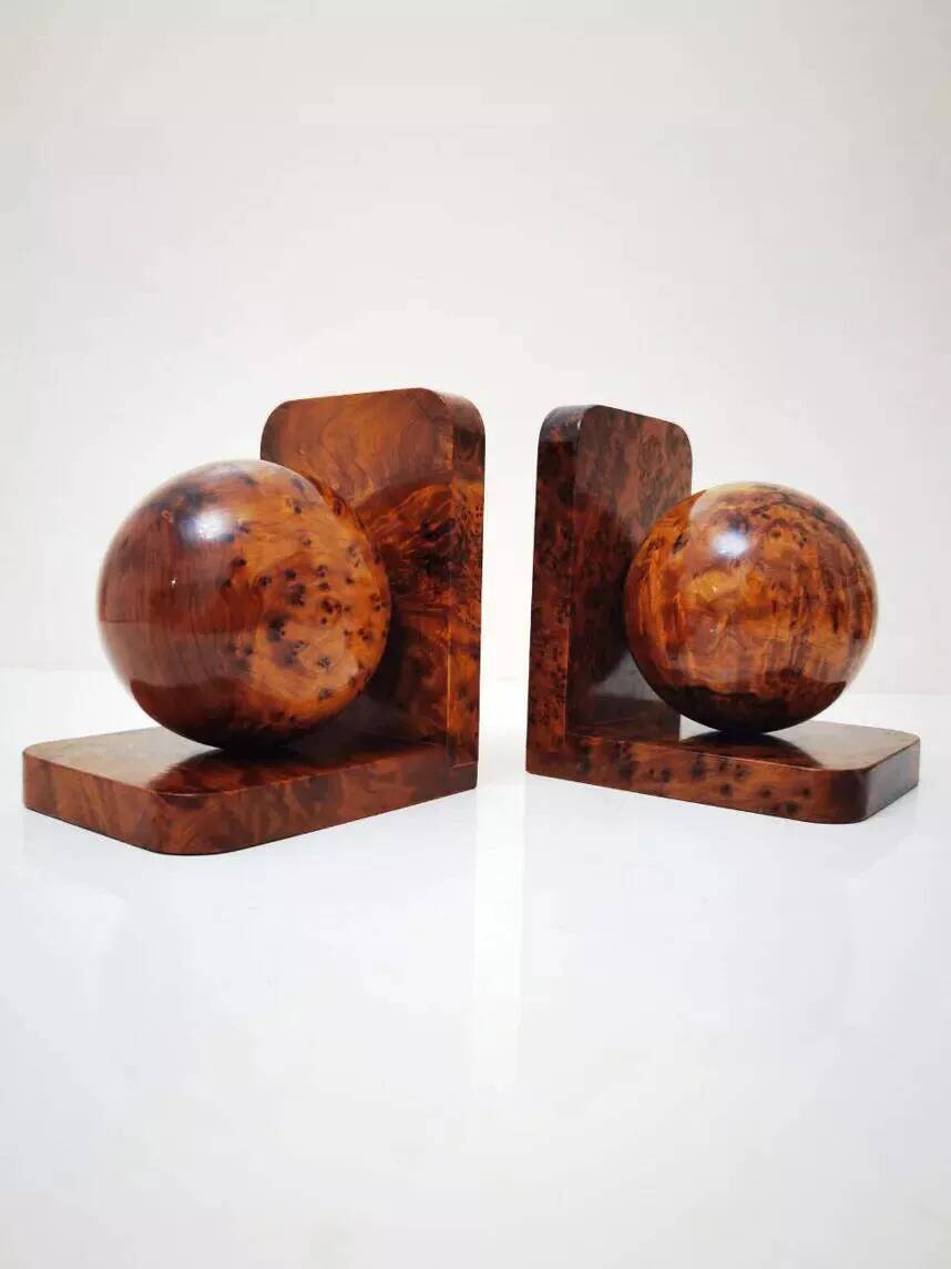 Art Deco bookends made of polished solid burl wood.