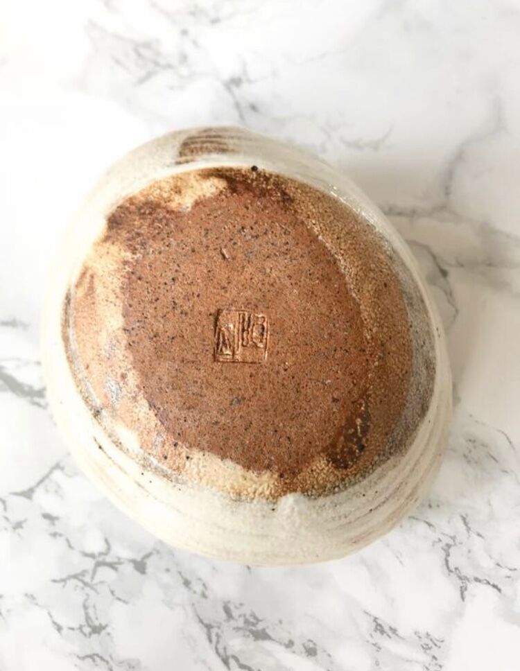 Pair of Asian handmade cups in beige and brown sandstone