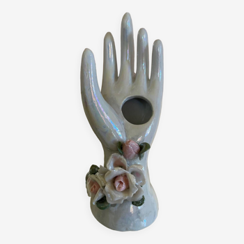 Hand holds jewelry or soliflore