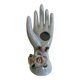Hand holds jewelry or soliflore