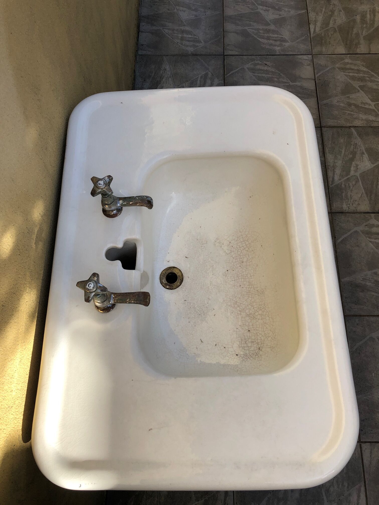 Antique washbasin on ceramic column