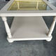 Table basse vintage crème rosé à double plateau et verre