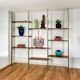 Tension pole free standing rose gold aluminum Omni wall unit by George Nelson