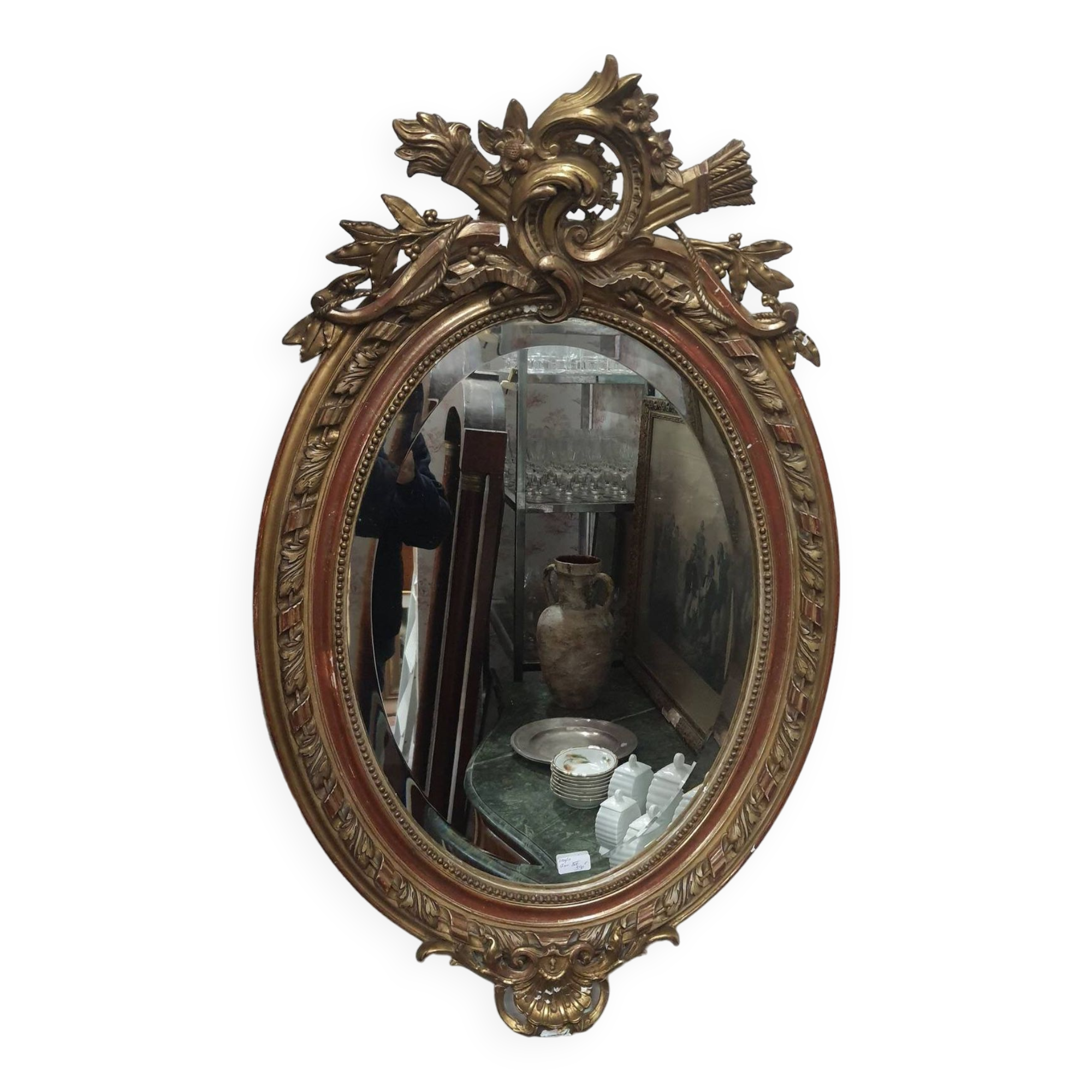 Golden oval mirror
