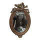 Golden oval mirror