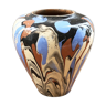 Vase dripping in varnished earth