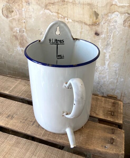 Old white and blue enamelled enema pot