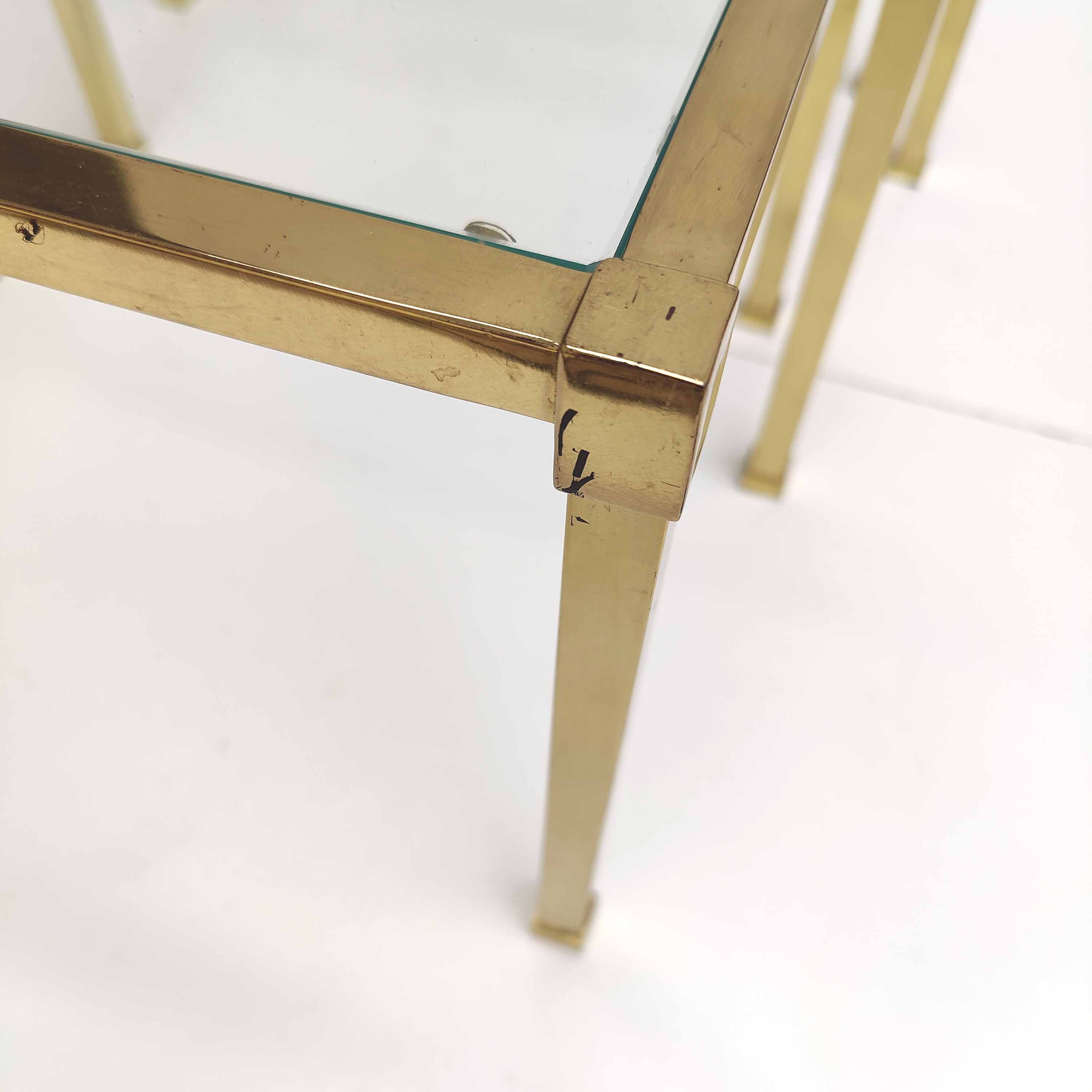 Brass and glass trundle tables