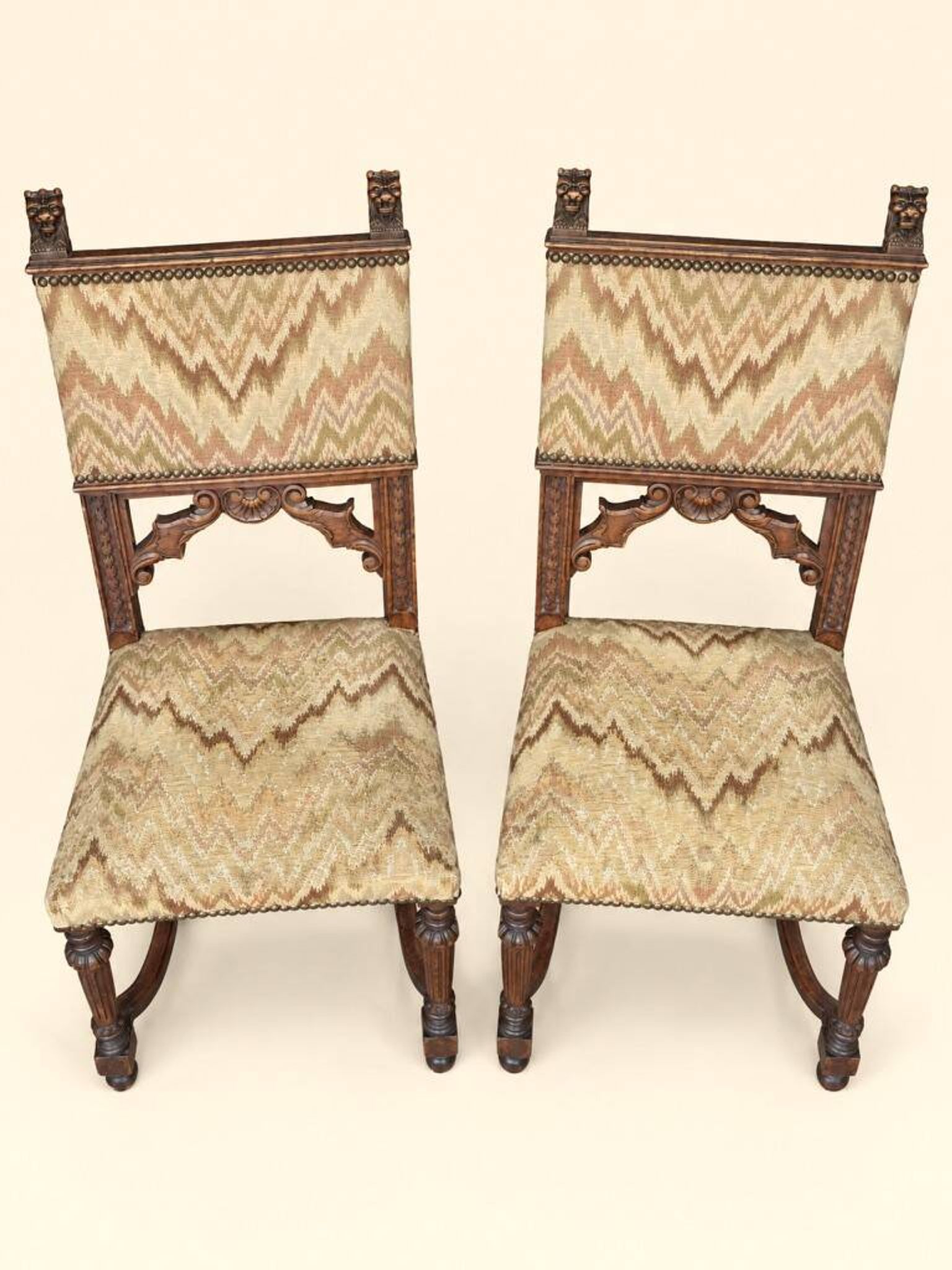 Pair of dining chairs, pair of carved Gothic chairs, set of Renaissance chairs.