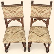 Pair of dining chairs, pair of carved Gothic chairs, set of Renaissance chairs.