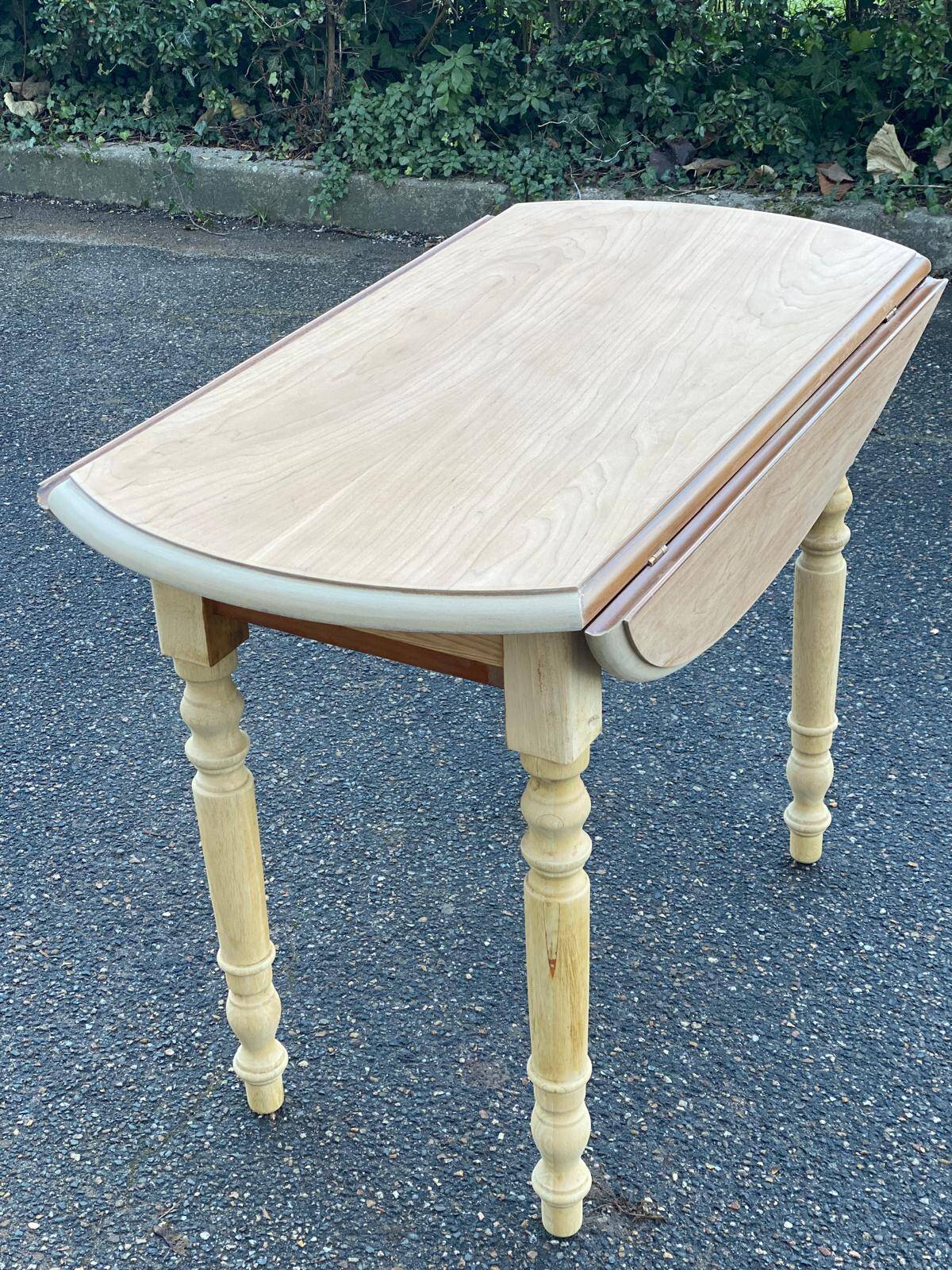 Round table with flaps or shutters renovated in raw solid wood