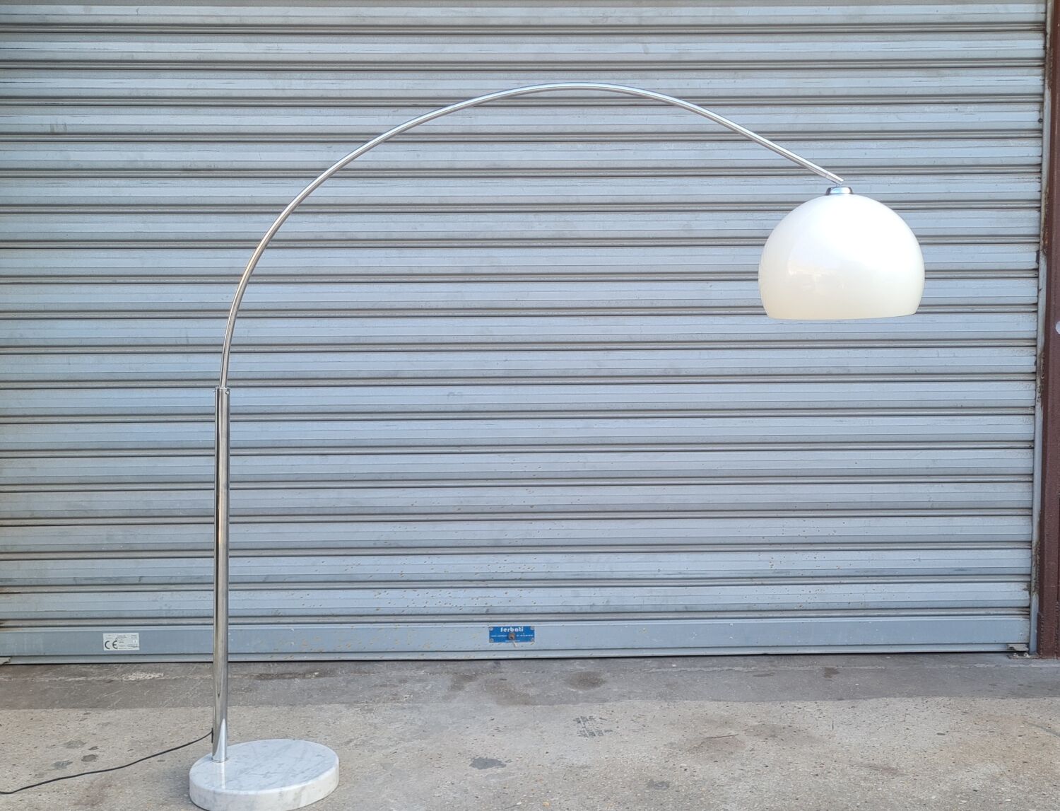 Arch floor lamp by Harvey guzzini 1970