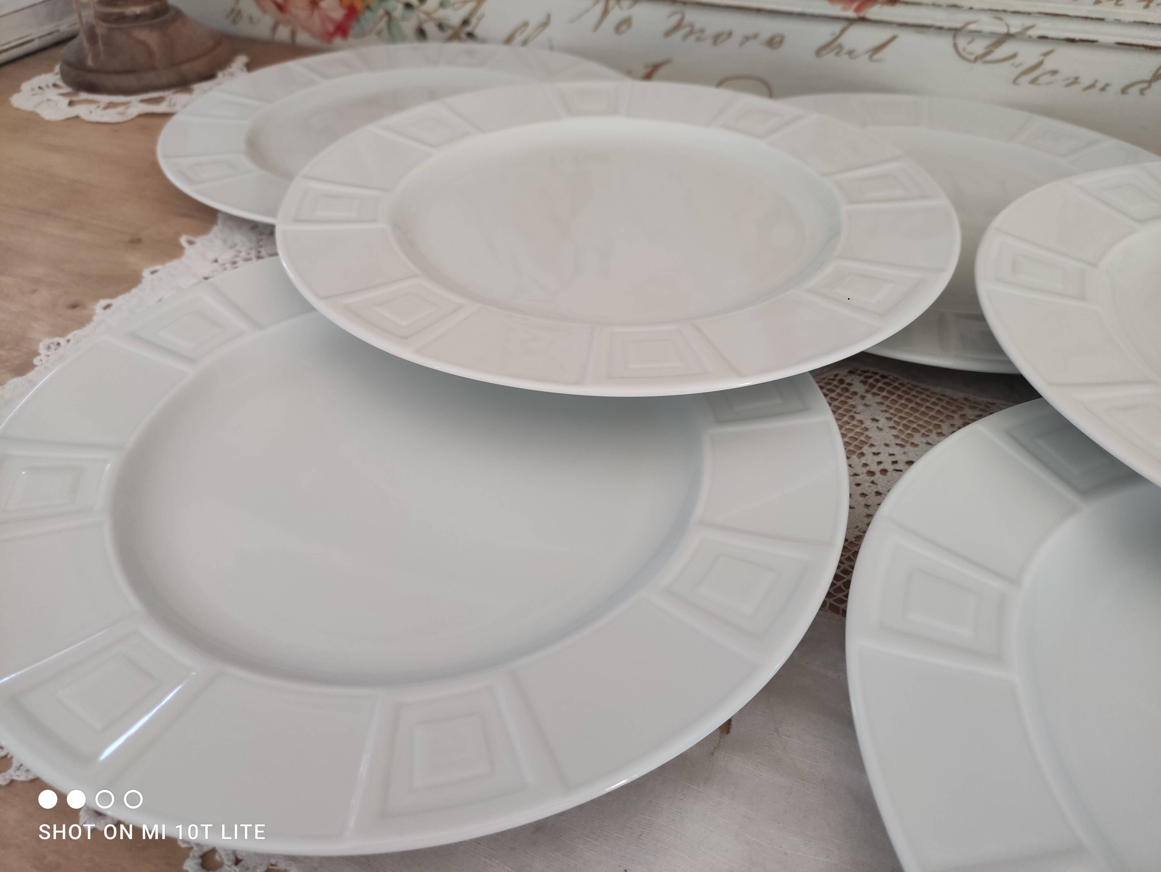 Set of 7 flat plates in white Limoges porcelain geometric decoration in relief