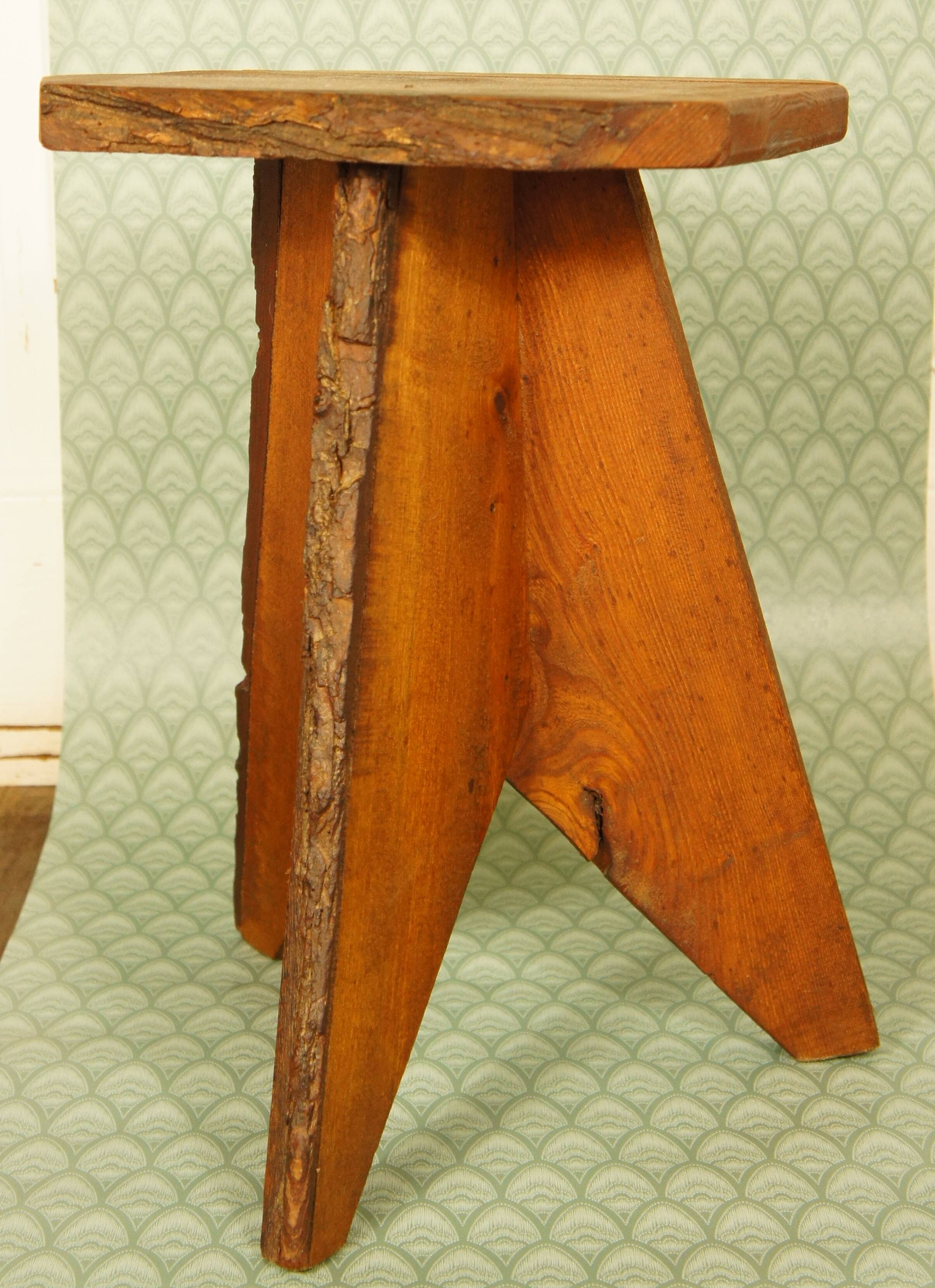 Brutalist stool tripod feet cross