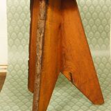 Brutalist stool tripod feet cross