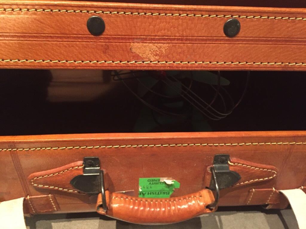 Thick leather suitcase