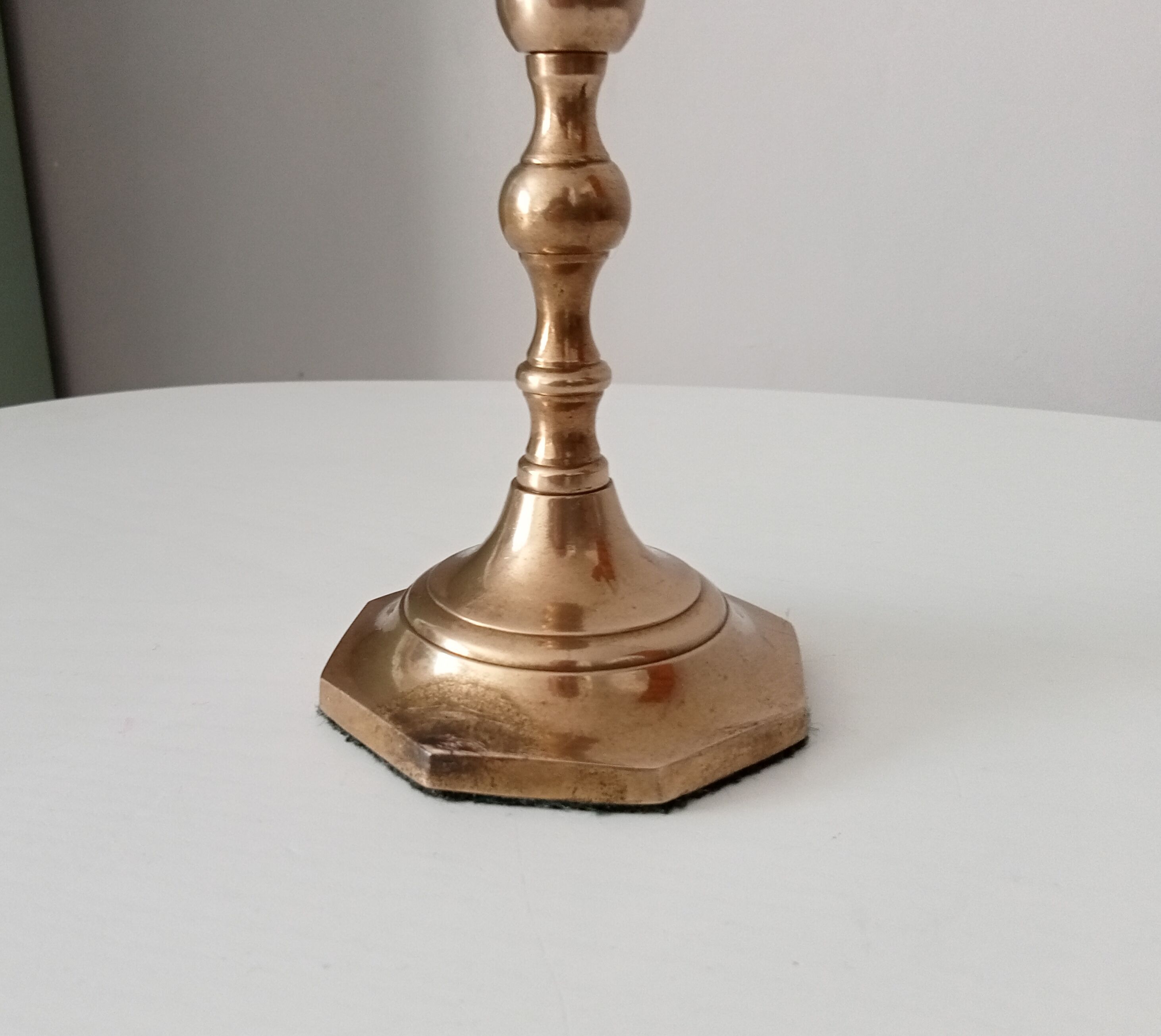 Antique candle holder in solid brass